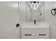Modern bathroom vanity with black fixtures, framed mirror, and undermount sink at 2080 Karen Ave # 12, Las Vegas, NV 89169