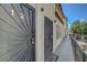 Condo building exterior featuring secure entry doors, neutral stucco and covered walkways at 2080 Karen Ave # 12, Las Vegas, NV 89169
