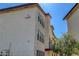 Condominium building with light stucco exterior, dark trim and desert landscaping at 2080 Karen Ave # 12, Las Vegas, NV 89169