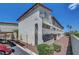 Attractive condo building with tan stucco exterior, red rock landscaping and covered parking at 2080 Karen Ave # 12, Las Vegas, NV 89169