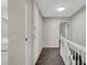 Hallway featuring neutral paint, carpeted floor, and built in storage unit at 2080 Karen Ave # 12, Las Vegas, NV 89169