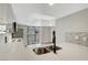 Spacious kitchen featuring a quartz countertop, backsplash, and patio access at 2080 Karen Ave # 12, Las Vegas, NV 89169