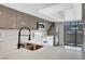 Modern kitchen with stainless steel appliances, sleek cabinetry, and quartz countertops at 2080 Karen Ave # 12, Las Vegas, NV 89169