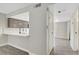 Open kitchen view showcasing quartz countertops, backsplash, and modern faucet at 2080 Karen Ave # 12, Las Vegas, NV 89169