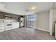 Modern kitchen features stainless steel appliances, sleek cabinetry, and sliding glass door to outdoor space at 2080 Karen Ave # 12, Las Vegas, NV 89169