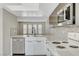 Modern kitchen with stainless steel appliances, backsplash, quartz countertops, and modern finishes at 2080 Karen Ave # 12, Las Vegas, NV 89169