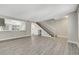 Stylish living room with updated flooring, neutral walls, open to kitchen and stairs to bedrooms at 2080 Karen Ave # 12, Las Vegas, NV 89169