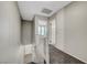 Carpeted staircase with white railing leads upstairs to hall with storage and doorways at 2080 Karen Ave # 12, Las Vegas, NV 89169