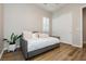 Cozy bedroom with plush daybed, neutral tones, a window, and a closet at 2450 Amatrice St, Henderson, NV 89044
