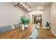 Elegant dining room with a long wooden table, stylish chairs, and modern chandelier lighting at 2450 Amatrice St, Henderson, NV 89044