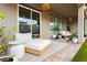 Outdoor patio with comfortable seating, stylish lighting, pavers, and lush landscaping at 2450 Amatrice St, Henderson, NV 89044