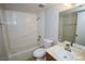 All white bathroom with shower/tub combo, and single sink vanity with mirror at 2755 Jennydiane Dr, Las Vegas, NV 89121