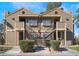 Inviting two-story townhome with dual staircases, classic siding, and manicured landscaping at 2755 Jennydiane Dr, Las Vegas, NV 89121