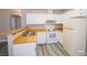Kitchen with white appliances, wood countertops, and wood-style flooring at 2755 Jennydiane Dr, Las Vegas, NV 89121