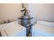 Laundry room with washer, dryer, and hot water heater at 2755 Jennydiane Dr, Las Vegas, NV 89121