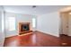 Inviting living room with a fireplace, complemented by laminate wood flooring at 2755 Jennydiane Dr, Las Vegas, NV 89121