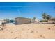 Expansive backyard with blue skies, palm trees, and a blank canvas for your landscaping dreams at 2807 Hermosa St, Las Vegas, NV 89169