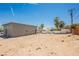 Expansive backyard with blue skies, palm trees, and a blank canvas for your landscaping dreams at 2807 Hermosa St, Las Vegas, NV 89169