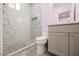 Bathroom featuring glass enclosed tiled shower, modern fixtures, and neutral color palette at 2807 Hermosa St, Las Vegas, NV 89169