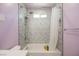 Bathtub and shower combination with tiled walls, a shower curtain, and updated fixtures at 2807 Hermosa St, Las Vegas, NV 89169