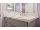 Bright bathroom featuring a modern vanity with a white countertop and chrome faucet fixtures at 2807 Hermosa St, Las Vegas, NV 89169