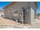 Exterior view of gray home with water heater, windows, and electrical connection at 2807 Hermosa St, Las Vegas, NV 89169