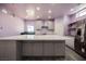 Well-lit, modern kitchen featuring an expansive center island and stainless steel appliances at 2807 Hermosa St, Las Vegas, NV 89169