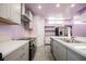 Kitchen featuring stainless appliances, modern countertops, and convenient access to other rooms at 2807 Hermosa St, Las Vegas, NV 89169