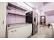 Bright pantry area with large freezer, stainless steel refrigerator, and ample shelf space for convenient storage at 2807 Hermosa St, Las Vegas, NV 89169