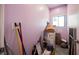 A room filled with items, including boxes, cleaning tools, and a hat on a box at 2807 Hermosa St, Las Vegas, NV 89169