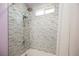 Modern shower with stylish horizontal tile, rainfall shower head and a small window for natural light at 2807 Hermosa St, Las Vegas, NV 89169
