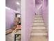 Interior staircase with door access and marble flooring, offering easy movement between floors at 2807 Hermosa St, Las Vegas, NV 89169