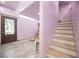 Interior staircase with door access and marble flooring, connecting the home's multiple levels at 2807 Hermosa St, Las Vegas, NV 89169