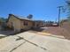Spacious backyard with gravel landscaping, covered patio, and block fencing at 2921 Mitzi Ave, Las Vegas, NV 89101