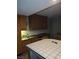 A kitchen featuring wooden cabinets and a white tiled kitchen island at 3111 Bel Air Dr # 6E, Las Vegas, NV 89109