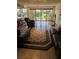 Living room with tile floors, slider doors to the balcony, and a view of the city at 3111 Bel Air Dr # 6E, Las Vegas, NV 89109