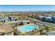 Enjoy an overhead view of a community pool surrounded by homes, providing a refreshing oasis for neighborhood residents at 350 Gandara St, Las Vegas, NV 89138