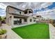 View of the home's exterior showcasing the spacious backyard and covered patio at 350 Gandara St, Las Vegas, NV 89138