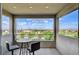 Balcony with seating area overlooking the neighborhood and distant mountains at 350 Gandara St, Las Vegas, NV 89138