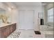 Bright bathroom with double vanity, soaking tub, and glass shower enclosure at 350 Gandara St, Las Vegas, NV 89138