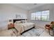 Serene bedroom featuring a large window, neutral decor, and comfortable furnishings at 350 Gandara St, Las Vegas, NV 89138
