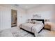 Bright bedroom featuring a plush bed, neutral decor, and an ensuite bathroom access at 350 Gandara St, Las Vegas, NV 89138