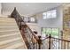 This grand foyer features a staircase, balcony and two-story living room with large windows at 350 Gandara St, Las Vegas, NV 89138
