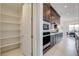 Chef's kitchen offering abundant dark wood cabinetry and a walk-in pantry at 350 Gandara St, Las Vegas, NV 89138