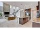 Bright living space features a stone fireplace, high ceilings, and an open layout connecting the kitchen at 350 Gandara St, Las Vegas, NV 89138