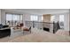 This comfortable loft features a sofa, seating area, outdoor access, and decorative artwork at 350 Gandara St, Las Vegas, NV 89138