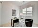Home office featuring a modern desk, large window, and a comfortable chair at 350 Gandara St, Las Vegas, NV 89138
