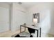 Home office with a large desk, modern lamp, and striped rug at 350 Gandara St, Las Vegas, NV 89138