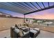 Spacious outdoor seating area with covered pergola and fantastic views of the surrounding community at 358 Solitude Peak Ln, Henderson, NV 89012