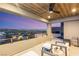 This home has a covered balcony with ceiling fan and a beautiful city view at 358 Solitude Peak Ln, Henderson, NV 89012